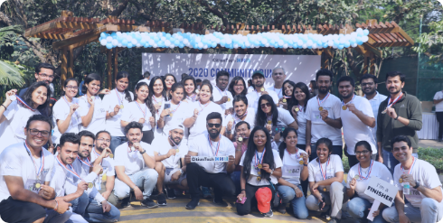 group of fun run organizers in white shirts