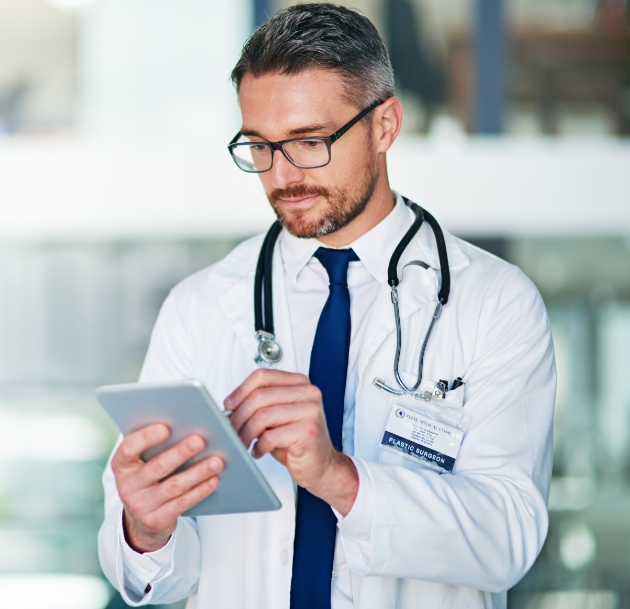 image of doctor using tablet