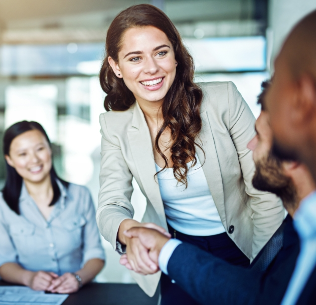 woman and man shaking hands