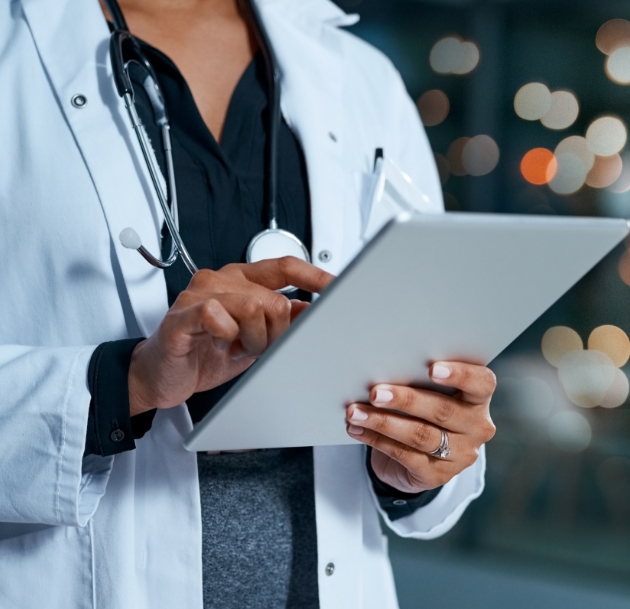 healthcare worker using a tablet