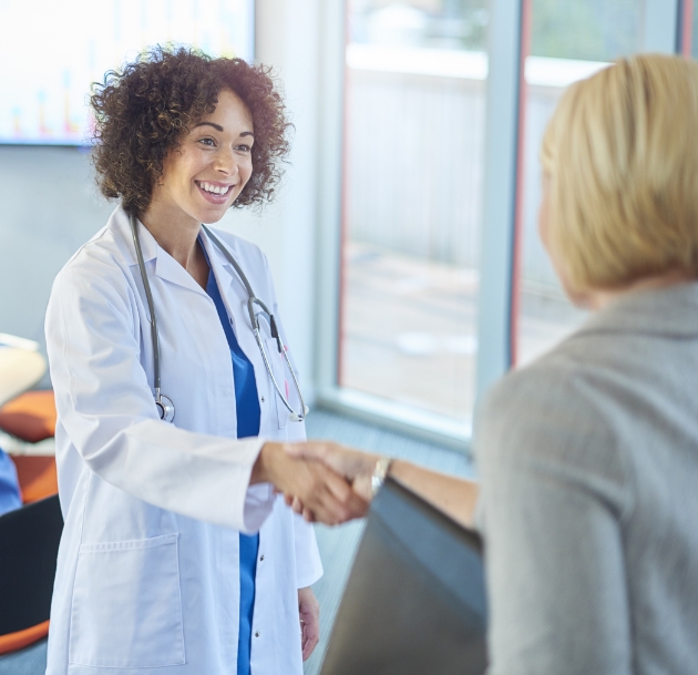 Doctor and patient shaking hands